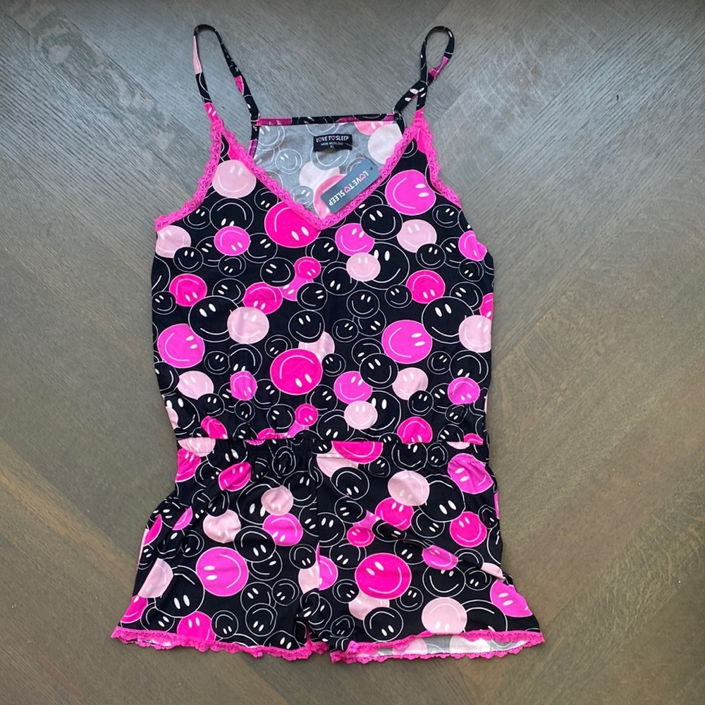 Pink and black smiley face sleep romper
